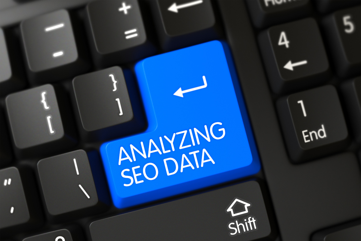 A blue keyboard button with the words ''Analyizing SEO Data