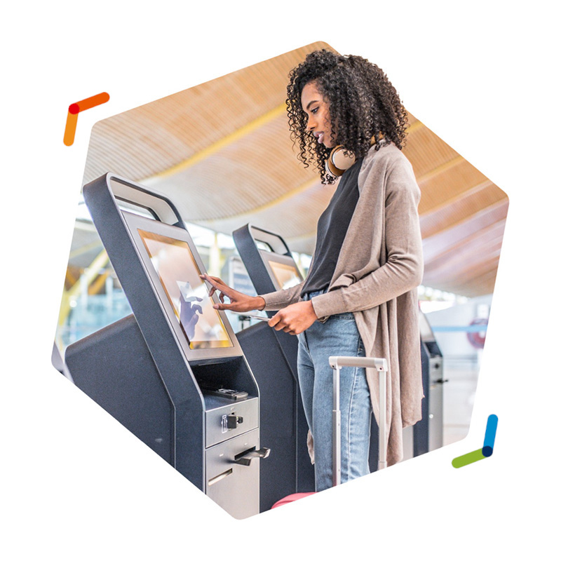 Traveling woman using self-service kiosk