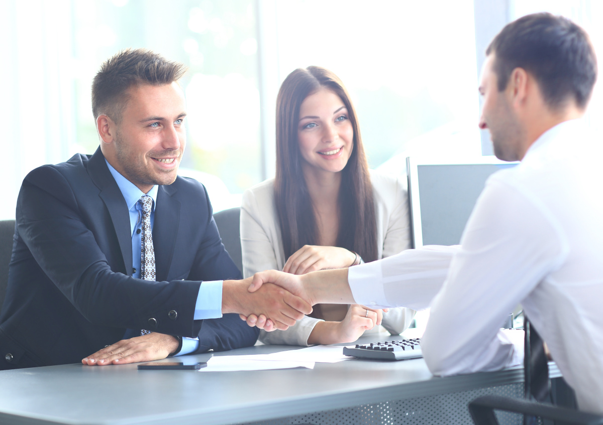 Woman shaking hands after job interview