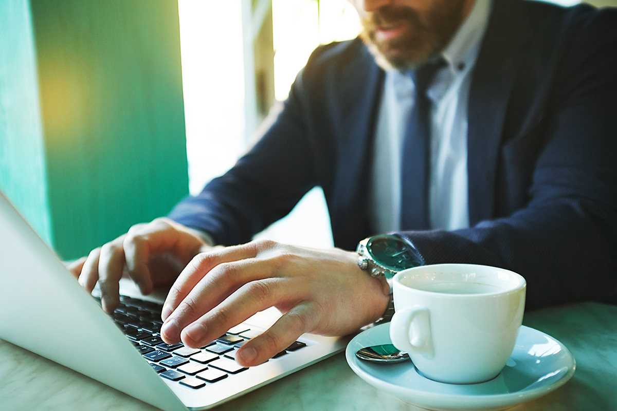 Man typing on laptop