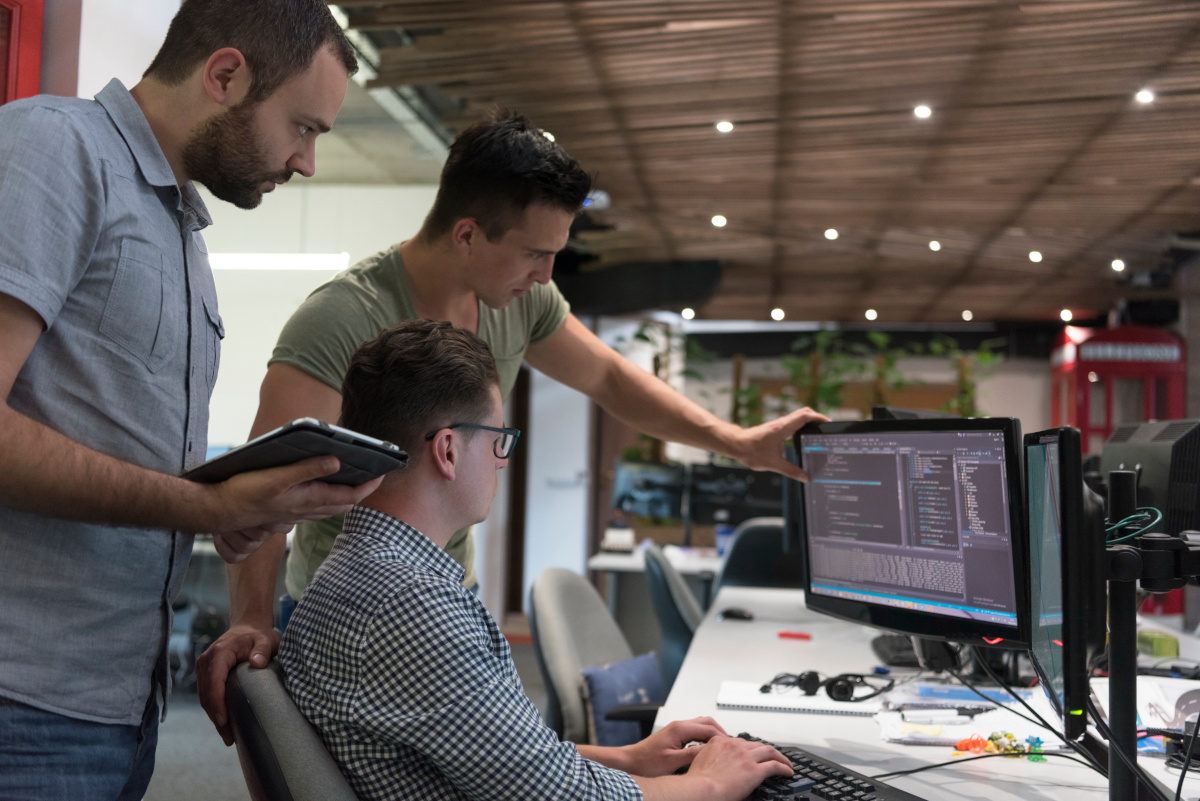 A group of developers working together to solve a problem